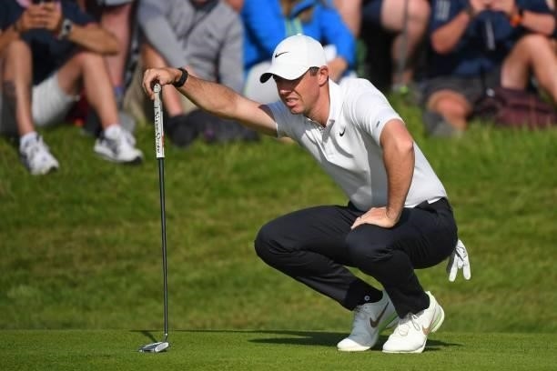 Northern Ireland's Rory McIlroy lines up a putt on the 7th green after playing from the rough during his first round on day one of The 149th British...