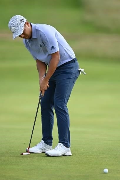 Golfer Xander Schauffele putts on the 11th green during his first round on day one of The 149th British Open Golf Championship at Royal St George's,...