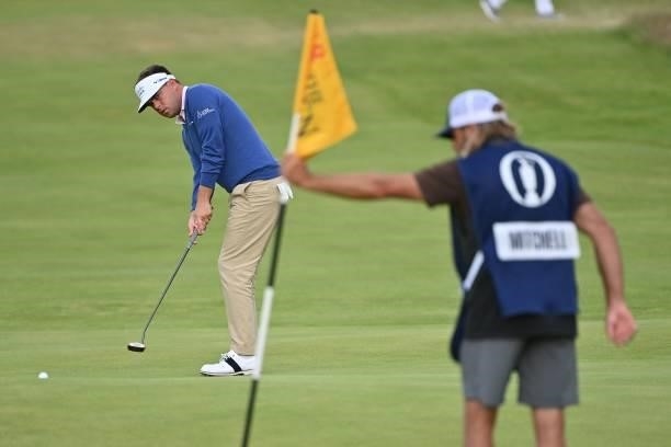 Golfer Keith Mitchell putts on the 18th green during his first round on day one of The 149th British Open Golf Championship at Royal St George's,...