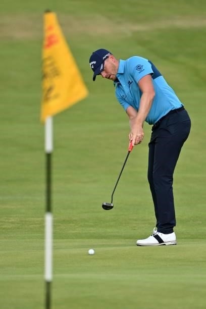 England's Matt Wallace putts on the 18th green during his first round on day one of The 149th British Open Golf Championship at Royal St George's,...