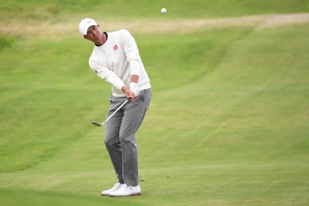 Australia's Adam Scott chips onto the 18th green during his first round on day one of The 149th British Open Golf Championship at Royal St George's,...