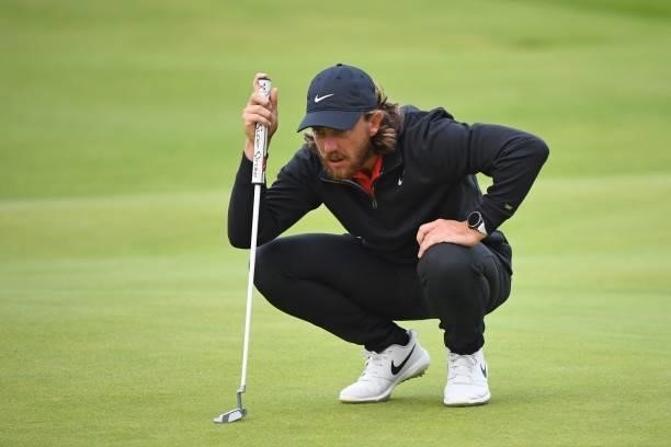 England's Tommy Fleetwood lines up a putt on the 18th green during his first round on day one of The 149th British Open Golf Championship at Royal St...