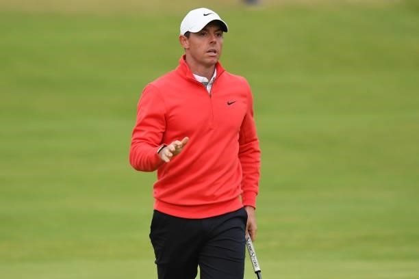 Northern Ireland's Rory McIlroy reacts after he holes his birdie putt on the 18th green during his first round on day one of The 149th British Open...