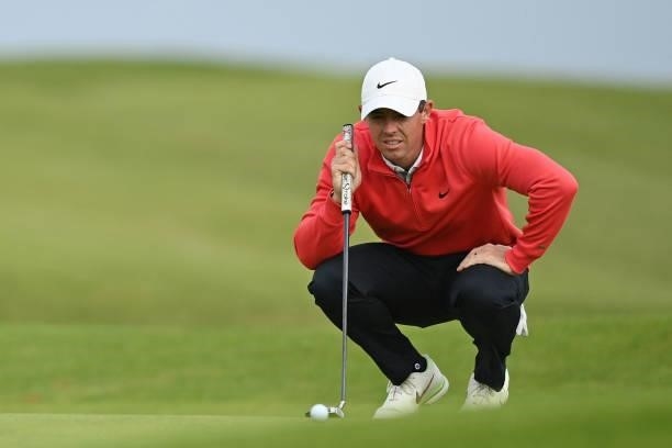 Northern Ireland's Rory McIlroy lines up a putt on the 12th green during his first round on day one of The 149th British Open Golf Championship at...