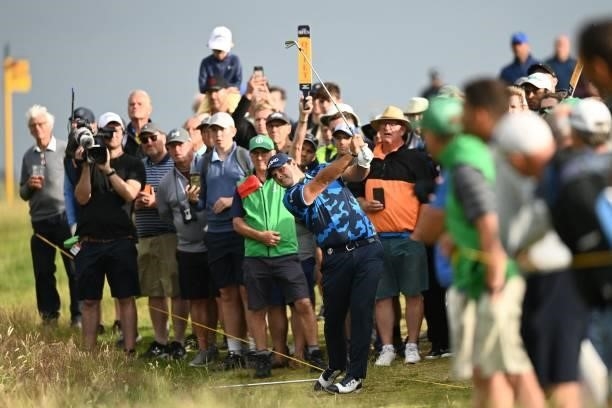 Golfer Patrick Reed plays from off the fairway on the 13th hole during his first round on day one of The 149th British Open Golf Championship at...