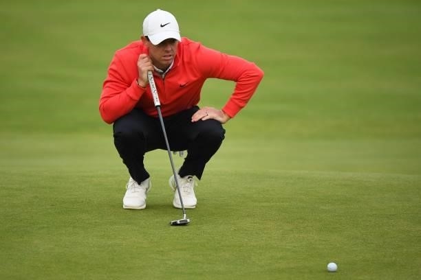 Northern Ireland's Rory McIlroy lines up a putt on the 18th green during his first round on day one of The 149th British Open Golf Championship at...