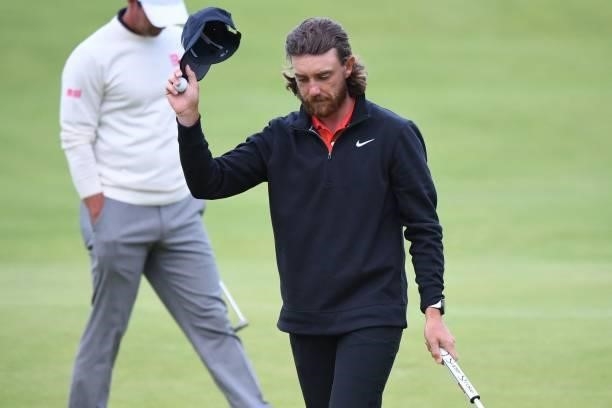 England's Tommy Fleetwood reacts after making his birdie putt on the 18th green during his first round on day one of The 149th British Open Golf...