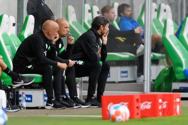 Head coach Mark van Bommel of VfL Wolfsburg sits on the bench during the Pre-Season Match between VfL Wolfsburg and Holstein Kiel at AOK-Stadion on...