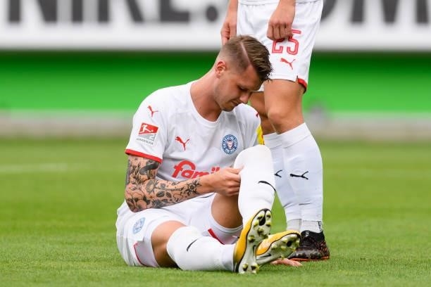 Holmbert Aron Fridjonsson of Holstein Kiel injured on the ground during the Pre-Season Match between VfL Wolfsburg and Holstein Kiel at AOK-Stadion...