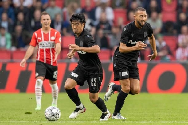 Shinji Kagawa of PAOK FC and Omar El Kaddouri of PAOK FC controls the ball during the Pre-Season Friendly match between PSV Eindhoven and PAOK FC at...