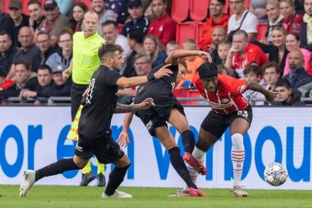 Noni Madueke of PSV Eindhoven battle for the ball during the Pre-Season Friendly match between PSV Eindhoven and PAOK FC at Philips Stadion on July...