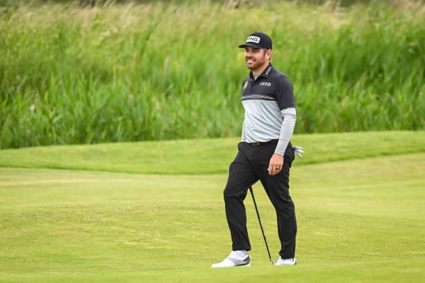 Louis Oosthuizen of South Africa smiles on the 14th hole fairway during Day One of the 149th The Open Championship at Royal St. Georges Golf Club on...