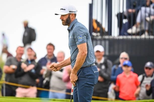 Dustin Johnson celebrates with a fist pump after making a birdie putt on the 15th hole green during Day One of the 149th The Open Championship at...