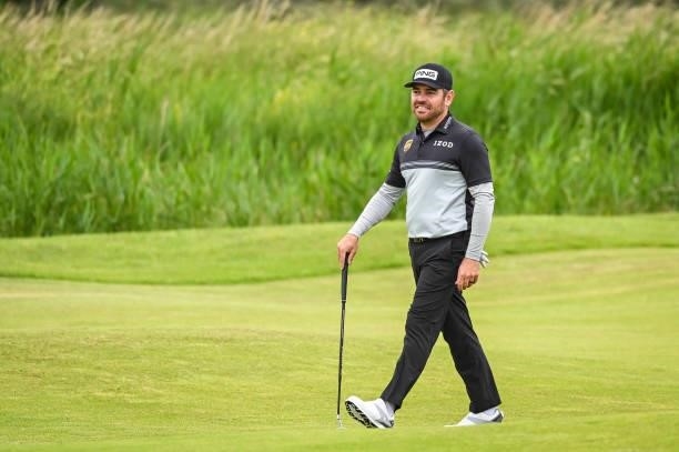 Louis Oosthuizen of South Africa smiles on the 14th hole fairway during Day One of the 149th The Open Championship at Royal St. Georges Golf Club on...