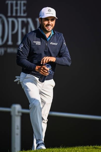 Abraham Ancer smiles walking off the first tee during Day One of the 149th The Open Championship at Royal St. Georges Golf Club on July 15, 2021 in...