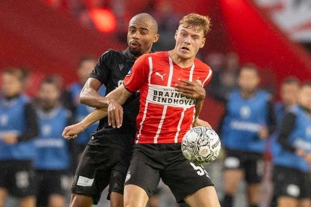 Lucas Taylor of PAOK FC and Yorbe Vertessen of PSV Eindhoven battle for the ball during the Pre-Season Friendly match between PSV Eindhoven and PAOK...