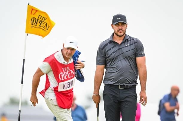 Brooks Koepka walks off the 17th hole green after making a par putt during Day One of the 149th The Open Championship at Royal St. Georges Golf Club...