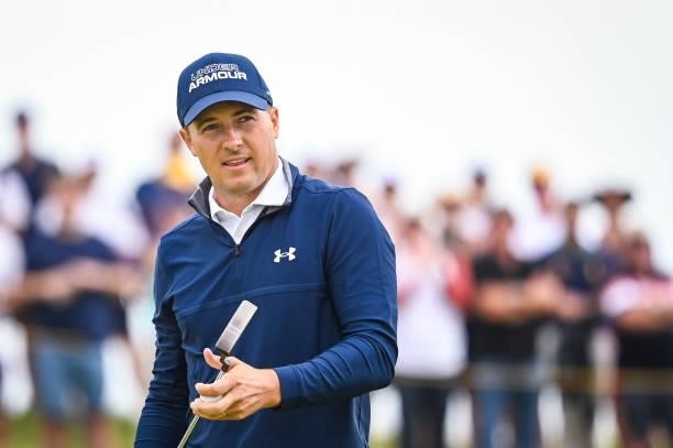 Jordan Spieth smiles after making a par saving putt on the ninth hole green during Day One of the 149th The Open Championship at Royal St. Georges...