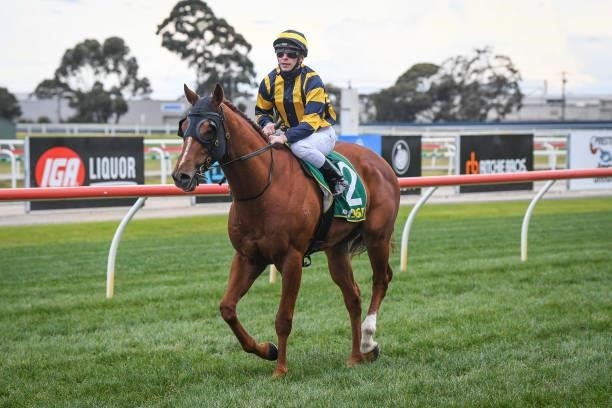 Ben Melham returns to the mounting yard on Out To Win after winning the Geelong Print Solutions BM64 Handicap, at Geelong Racecourse on July 16, 2021...