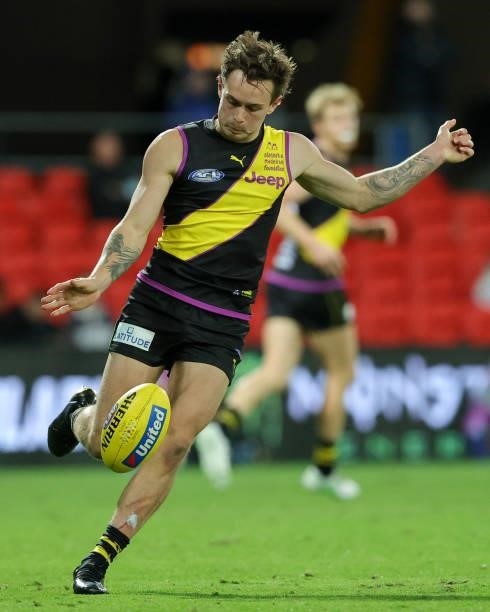 Rhyan Mansell kicks the ball during the 2021 AFL Round 18 match between the Richmond Tigers and the Brisbane Lions at Metricon Stadium on July 16,...
