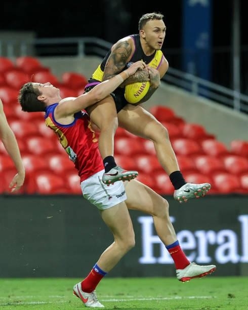 Shai Bolton marks the ball during the 2021 AFL Round 18 match between the Richmond Tigers and the Brisbane Lions at Metricon Stadium on July 16, 2021...