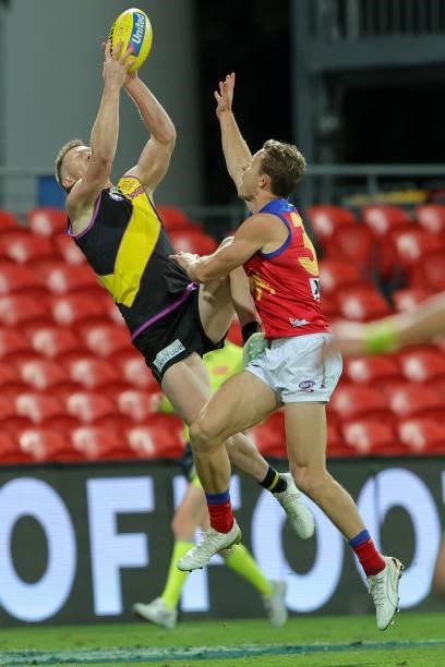 Jack Riewoldt with a high flying mark during the 2021 AFL Round 18 match between the Richmond Tigers and the Brisbane Lions at Metricon Stadium on...