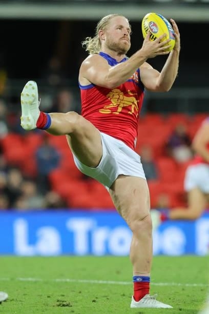 Daniel Rich marks the ball during the 2021 AFL Round 18 match between the Richmond Tigers and the Brisbane Lions at Metricon Stadium on July 16, 2021...