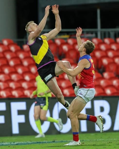 Jack Riewoldt with a high flying mark during the 2021 AFL Round 18 match between the Richmond Tigers and the Brisbane Lions at Metricon Stadium on...