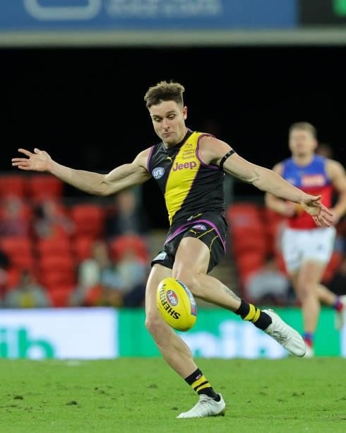 Jayden Short looks to pass the ball during the 2021 AFL Round 18 match between the Richmond Tigers and the Brisbane Lions at Metricon Stadium on July...