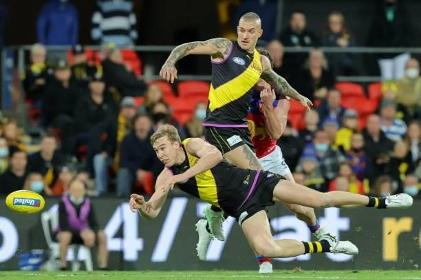 Tom J. Lynch slaps the ball away during the 2021 AFL Round 18 match between the Richmond Tigers and the Brisbane Lions at Metricon Stadium on July...