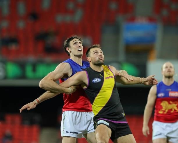 Oscar McInerney and Toby Nankervis contest the ruck during the 2021 AFL Round 18 match between the Richmond Tigers and the Brisbane Lions at Metricon...