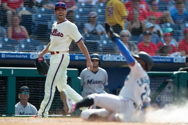 Matt Moore of the Philadelphia Phillies reacts as Jazz Chisholm Jr. #2 of the Miami Marlins slides home safely in the top of the second inning during...