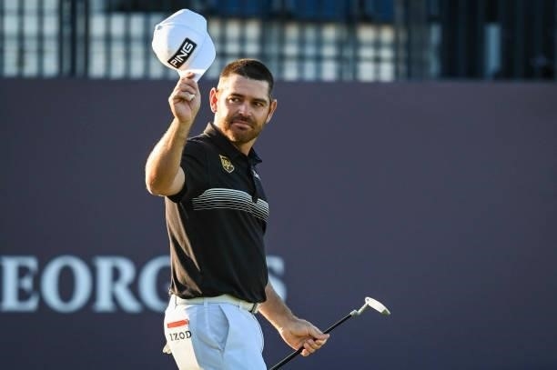 Louis Oosthuizen of South Africa tips his cap to fans after finishing play on the 18th hole green during Day Two of the 149th The Open Championship...