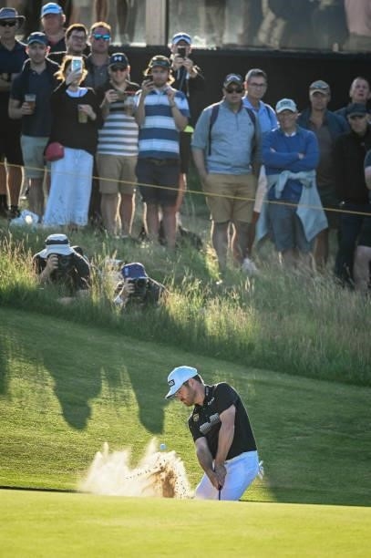 Louis Oosthuizen of South Africa plays a shot from a greenside bunker on the 16th hole during Day Two of the 149th The Open Championship at Royal St....