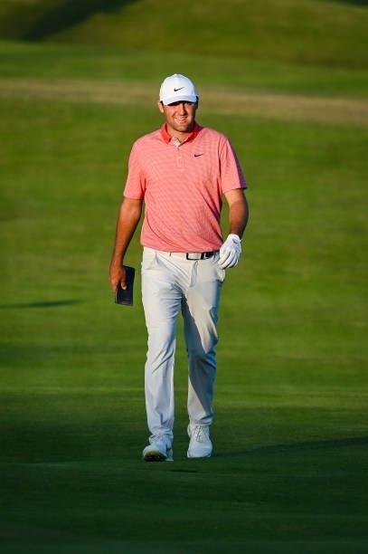 Scottie Scheffler smiles as he walks to the 18th hole green during Day Two of the 149th The Open Championship at Royal St. Georges Golf Club on July...
