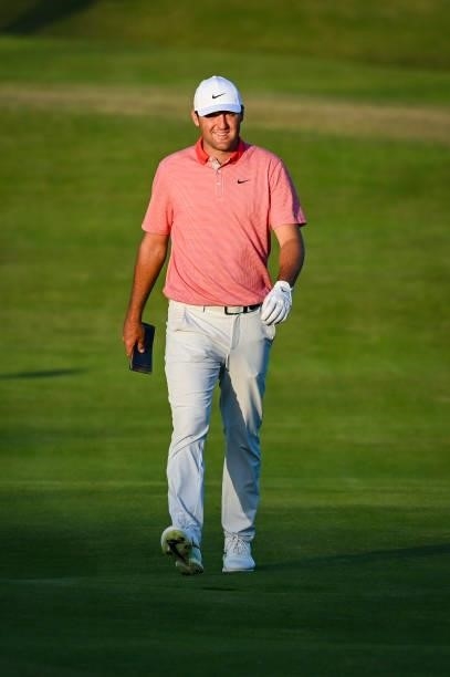 Scottie Scheffler smiles as he walks to the 18th hole green during Day Two of the 149th The Open Championship at Royal St. Georges Golf Club on July...