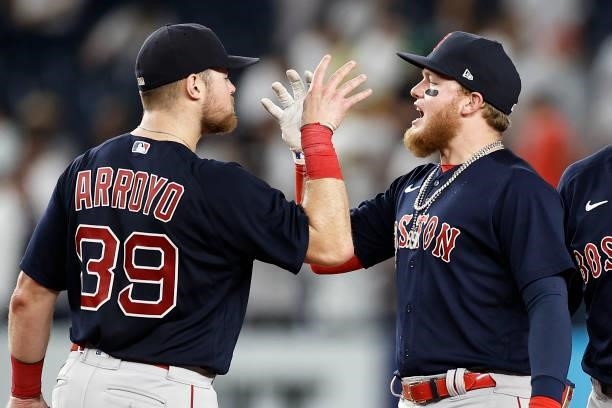 Alex Verdugo of the Boston Red Sox and Christian Arroyo of the Boston Red Sox celebrate after defeating the New York Yankees at Yankee Stadium on...