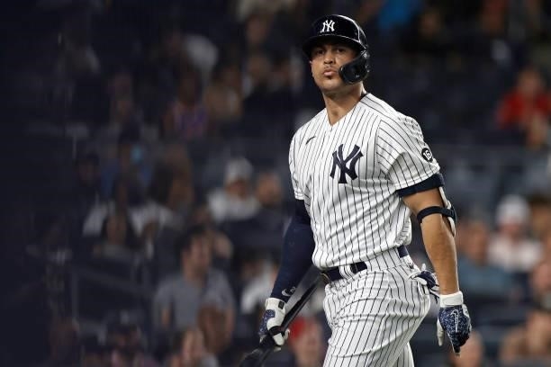 Giancarlo Stanton of the New York Yankees reacts after striking out during the eighth inning against the Boston Red Sox at Yankee Stadium on July 16,...
