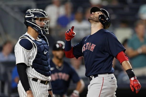Martinez of the Boston Red Sox celebrates a solo home run in front of Gary Sanchez of the New York Yankees during the eighth inning at Yankee Stadium...