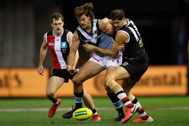 Scott Lycett of the Power is tackled by Paddy Ryder of the Saints during the 2021 AFL Round 18 match between the St Kilda Saints and the Port...