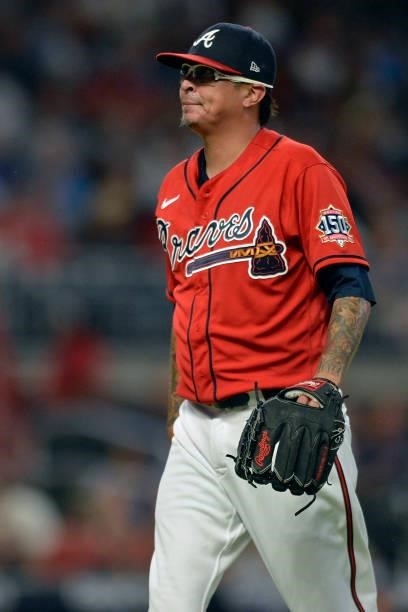 Jesse Chavez of the Atlanta Braves walks back to the dugout after the top of the tenth inning against the Tampa Bay Rays at Truist Park on July 16,...