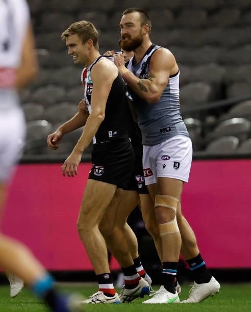 Dougal Howard of the Saints and Charlie Dixon of the Power clash during the 2021 AFL Round 18 match between the St Kilda Saints and the Port Adelaide...