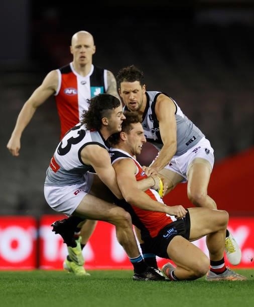 Luke Dunstan of the Saints is tackled by Darcy Byrne-Jones of the Power during the 2021 AFL Round 18 match between the St Kilda Saints and the Port...