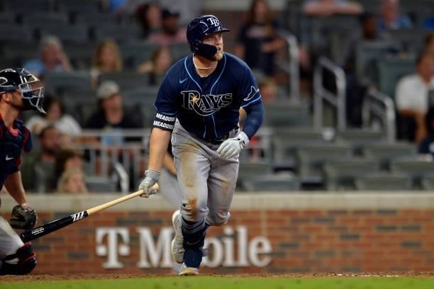 Austin Meadows of the Tampa Bay Rays runs to first base in the tenth inning against the Atlanta Braves at Truist Park on July 16, 2021 in Atlanta,...