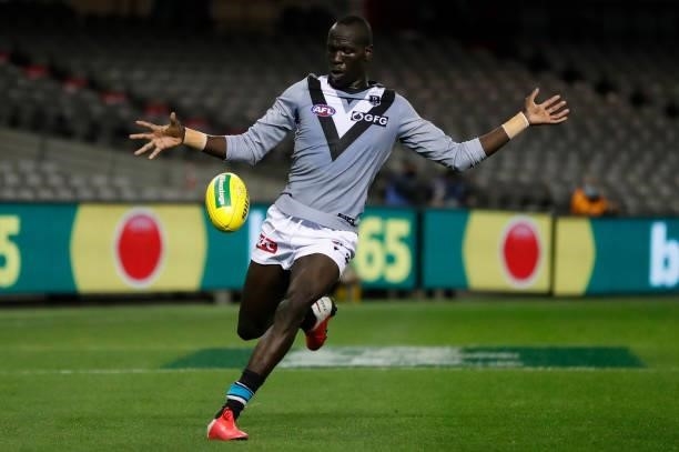 Aliir Aliir of the Power kicks the ball during the 2021 AFL Round 18 match between the St Kilda Saints and the Port Adelaide Power at Marvel Stadium...