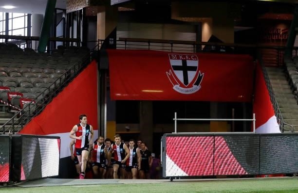 The Saints walk up the race during the 2021 AFL Round 18 match between the St Kilda Saints and the Port Adelaide Power at Marvel Stadium on July 17,...