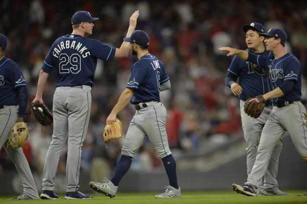 Pete Fairbanks, Brandon Lowe, Ji-Man Choi, and Joey Wendle of the Tampa Bay Rays celebrate their win over the Atlanta Braves at Truist Park on July...