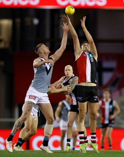 Rowan Marshall of the Saints and Peter Ladhams of the Power compete in a ruck contest during the 2021 AFL Round 18 match between the St Kilda Saints...