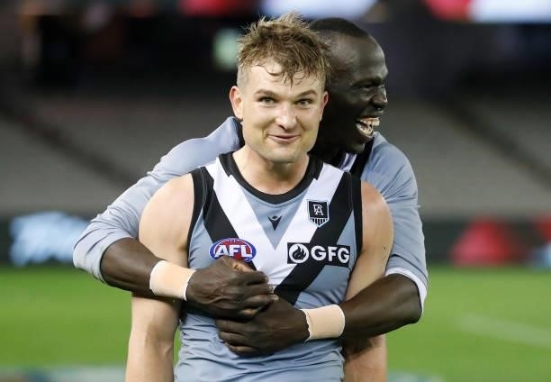 Ollie Wines and Aliir Aliir of the Power celebrate during the 2021 AFL Round 18 match between the St Kilda Saints and the Port Adelaide Power at...