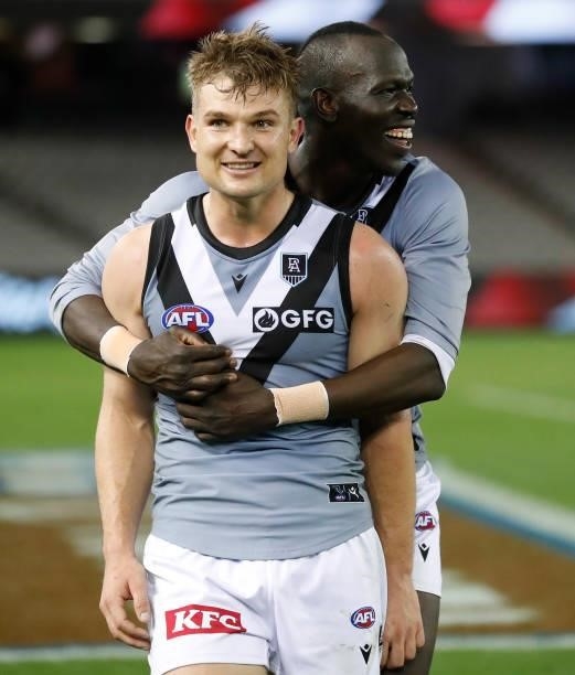 Ollie Wines and Aliir Aliir of the Power celebrate during the 2021 AFL Round 18 match between the St Kilda Saints and the Port Adelaide Power at...